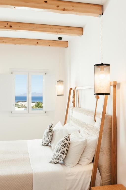Postel nebo postele na pokoji v ubytování Casa Vitae Suites