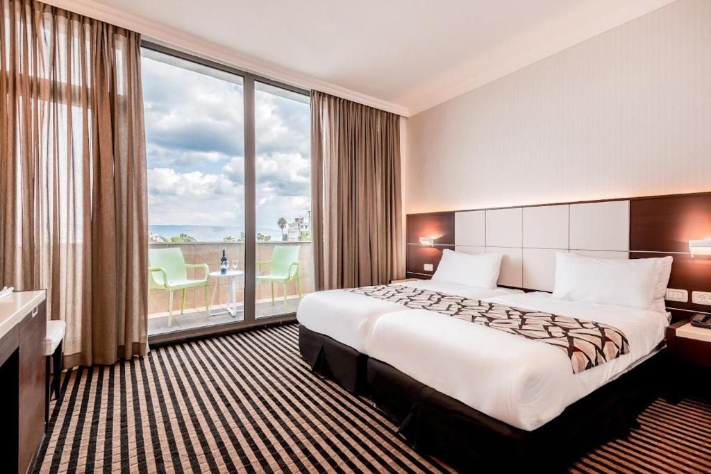 Postel nebo postele na pokoji v ubytování Golan Hotel