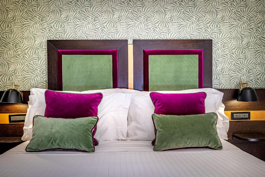 Postel nebo postele na pokoji v ubytování Hotel Duomo Firenze