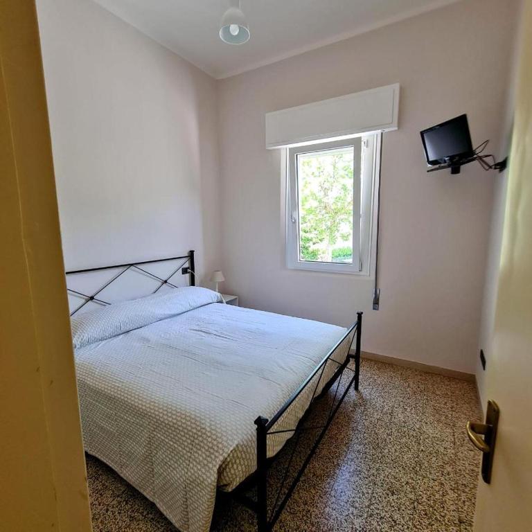 Postel nebo postele na pokoji v ubytování Borgomare Camere e Colazioni