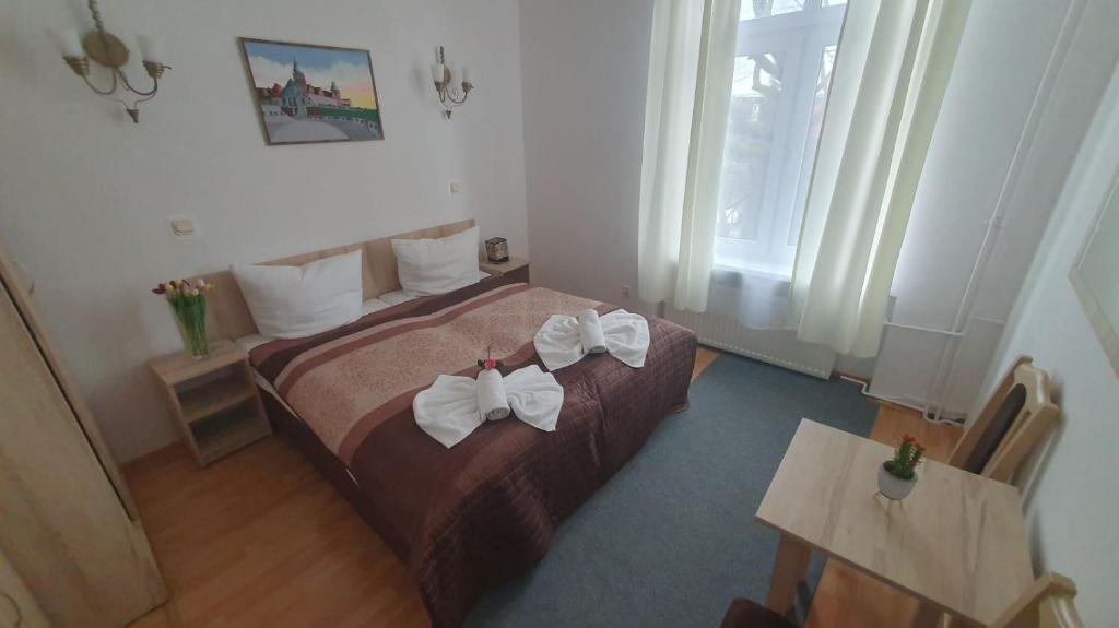 Postel nebo postele na pokoji v ubytování OW Meduza i Biala Mewa