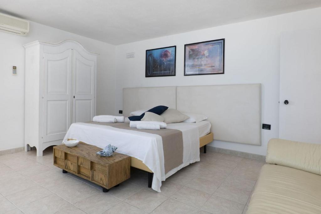 Postel nebo postele na pokoji v ubytování Apulia Hotel Ugento Cala Blu