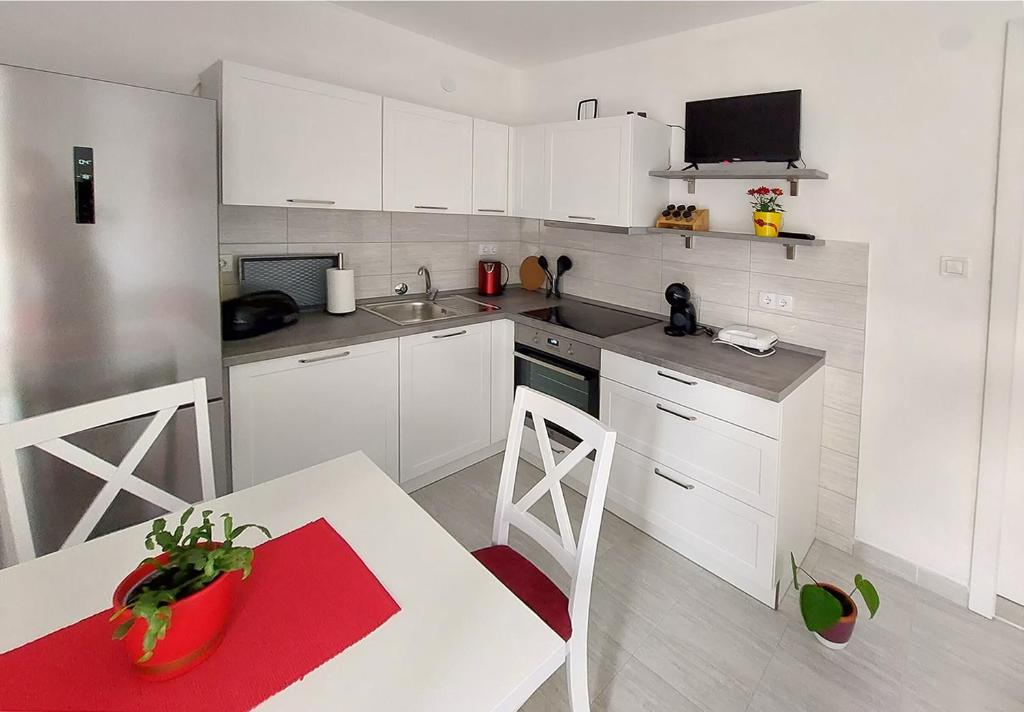 Kuchyň nebo kuchyňský kout v ubytování Apartment Oliva