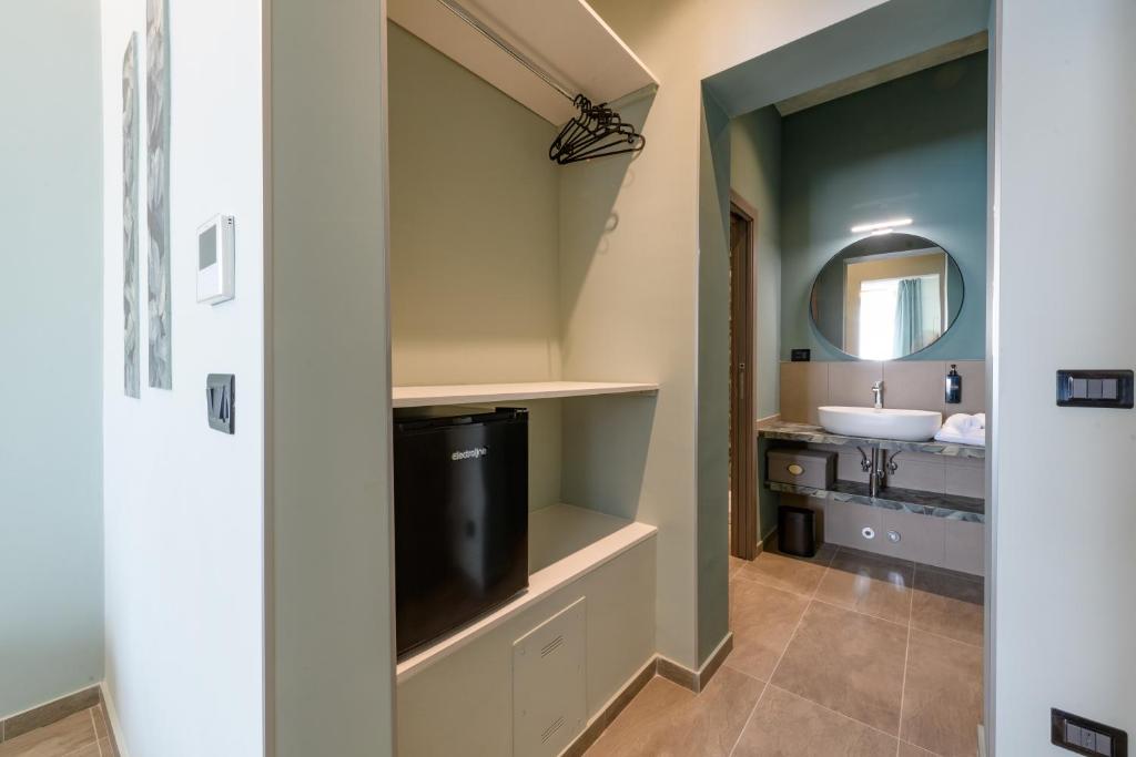 Postel nebo postele na pokoji v ubytování Rooms Don Alfonso