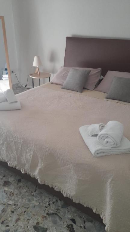 Un ou plusieurs lits dans un hébergement de l'établissement Miro B&B