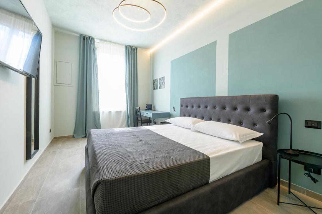 Postel nebo postele na pokoji v ubytování Rooms Don Alfonso