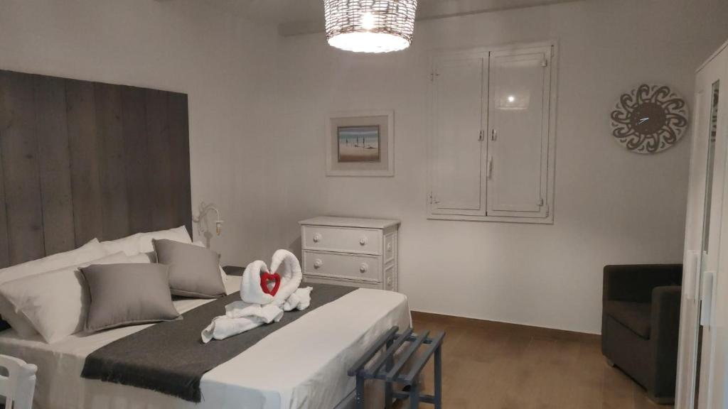 a bedroom with a bed with a stuffed animal on it at Lovin Puglia Vacation in Bari