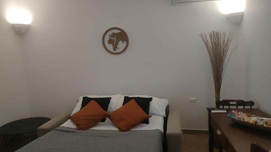 a living room with a couch with pillows on it at Lovin Puglia Vacation in Bari