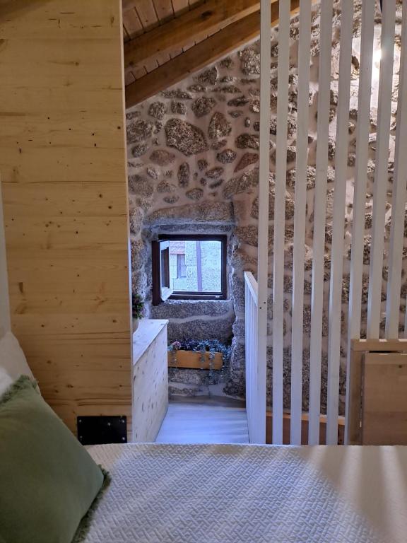 Postel nebo postele na pokoji v ubytování VillaGarcia-Casa da Marianinha