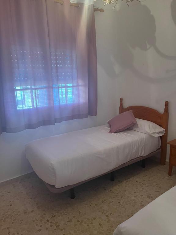Postel nebo postele na pokoji v ubytování VILLA LA MOMITA