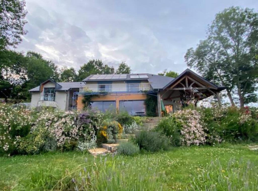 a house with a garden in front of it at Poulou Pyrénées in Gelos