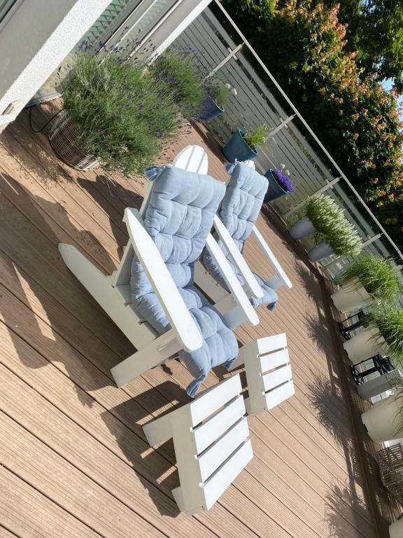 an overhead view of two lounge chairs on a deck at Playa Baltis Apartamenty Club di Mare in Międzyzdroje