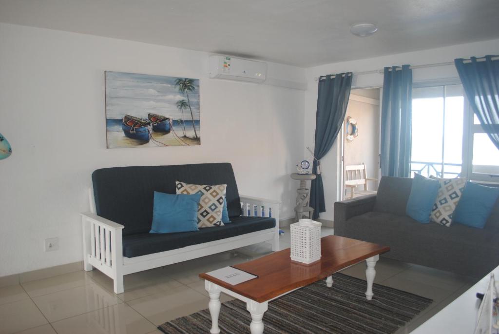 a living room with a couch and a coffee table at 6 Key Largo in Kingsburgh