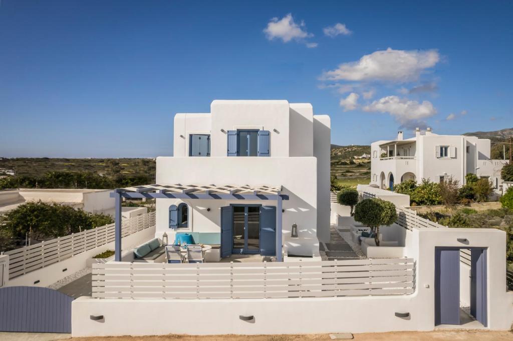 a view of a house with white at Pebble Summer House in Kampos Paros