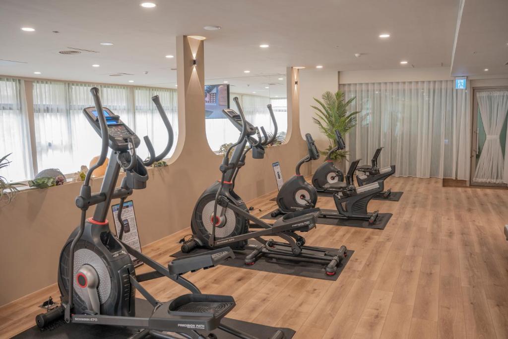 a row of exercise bikes in a gym at H Resort in Checheng
