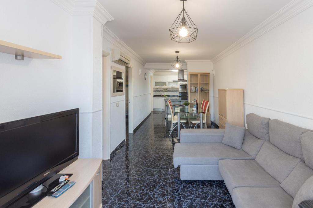 Telewizja i/lub zestaw kina domowego w obiekcie Lightbooking playa de Amadores La Concha