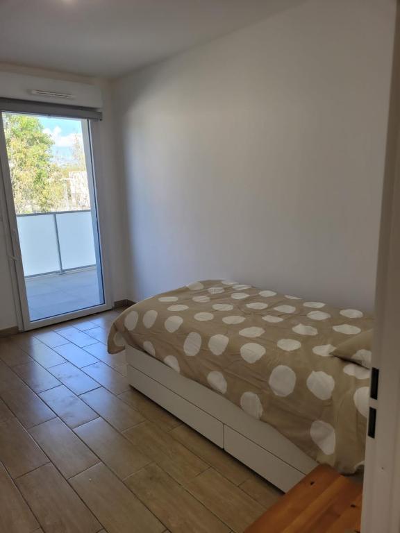 Posteľ alebo postele v izbe v ubytovaní Superbes appartements neufs à Montpellier