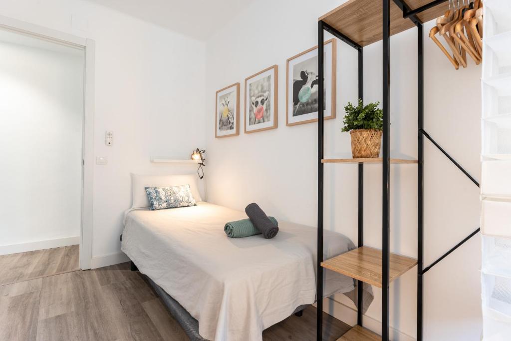 Postel nebo postele na pokoji v ubytování MalagaSuite Lovely Home