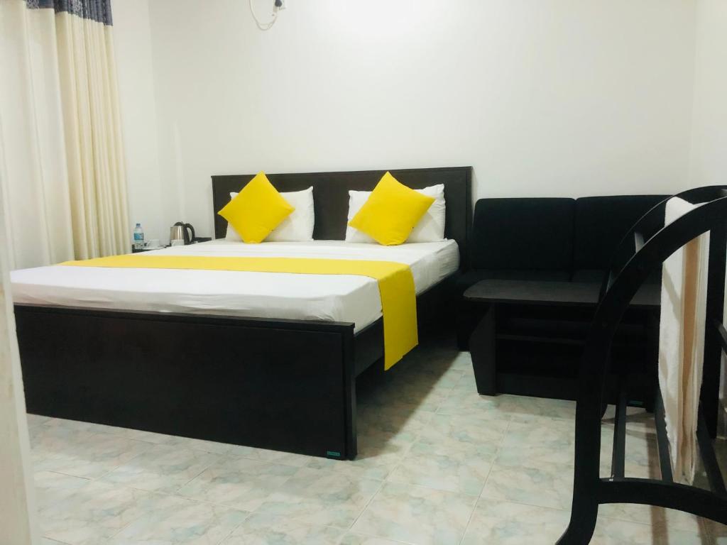 Postel nebo postele na pokoji v ubytování White Land City Hotel
