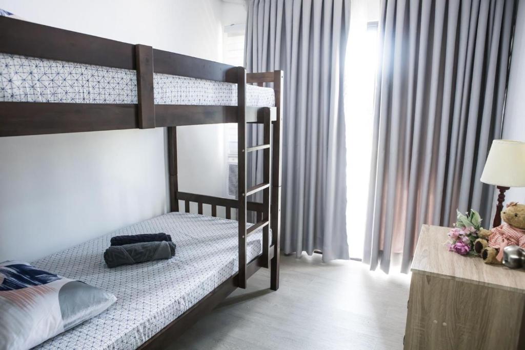 Postel nebo postele na pokoji v ubytování One Oasis 2BR Condo in Mabolo-near SM, Ayala, IT park