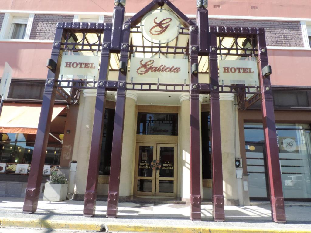 a store front of a building with the doors open at Hotel Galicia in Trelew