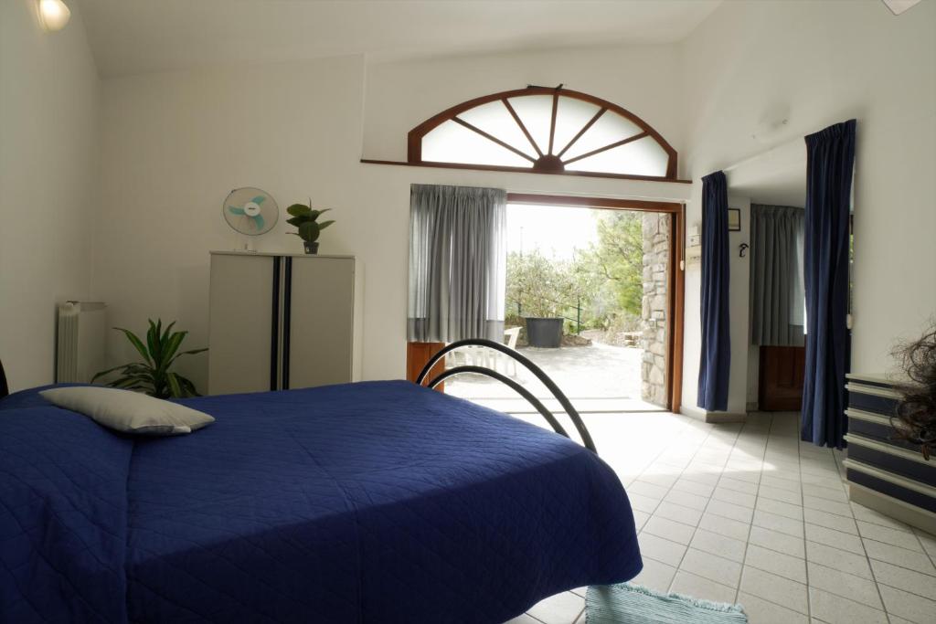 Letto o letti in una camera di U Ciousu by Ligurian Life APPARTAMENTI IN AGRITURISMO