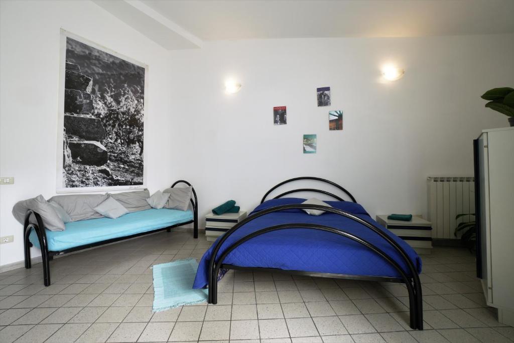 Letto o letti in una camera di U Ciousu by Ligurian Life APPARTAMENTI IN AGRITURISMO