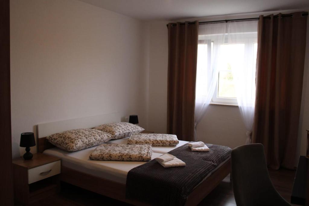 Postel nebo postele na pokoji v ubytování Apartman Villarossa
