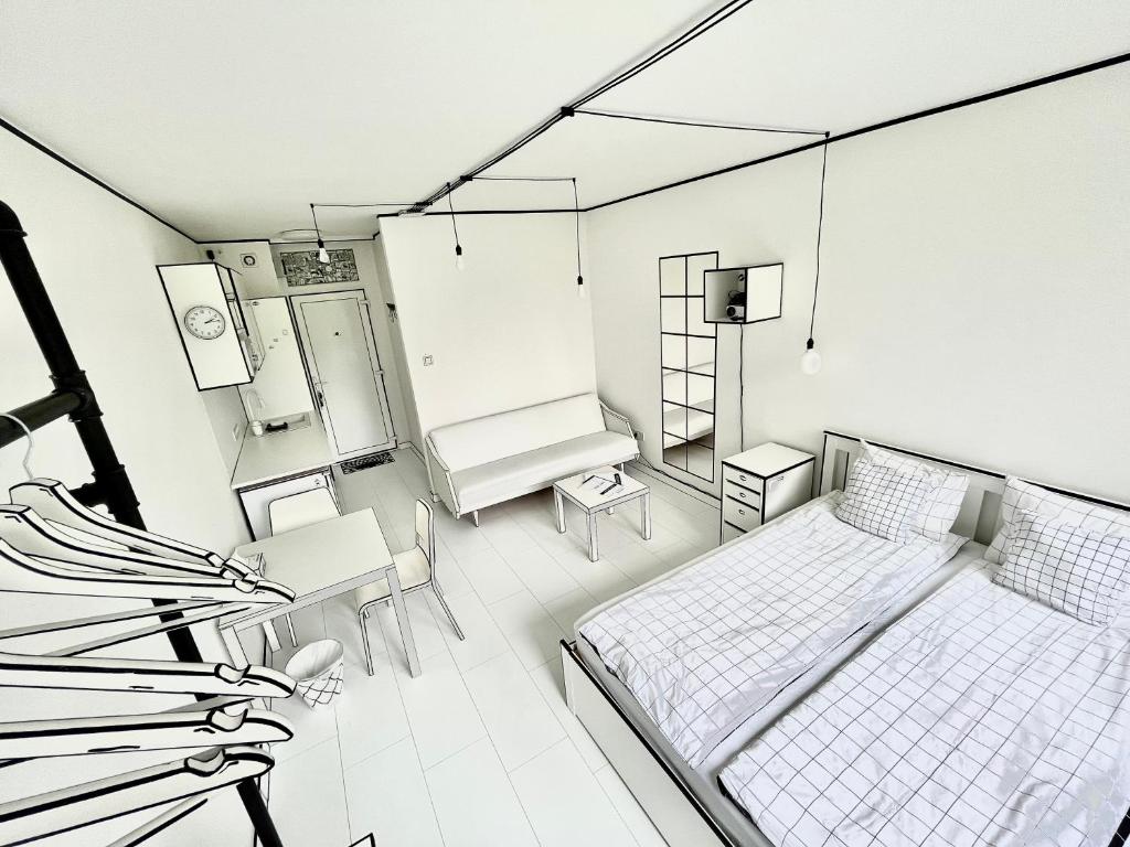 2D Apartment في سكسارد: غرفة بسرير وطاولة وكراسي