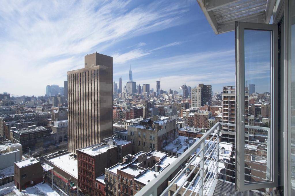 a view of a city skyline from a skyscraper at Hotel on Rivington in New York