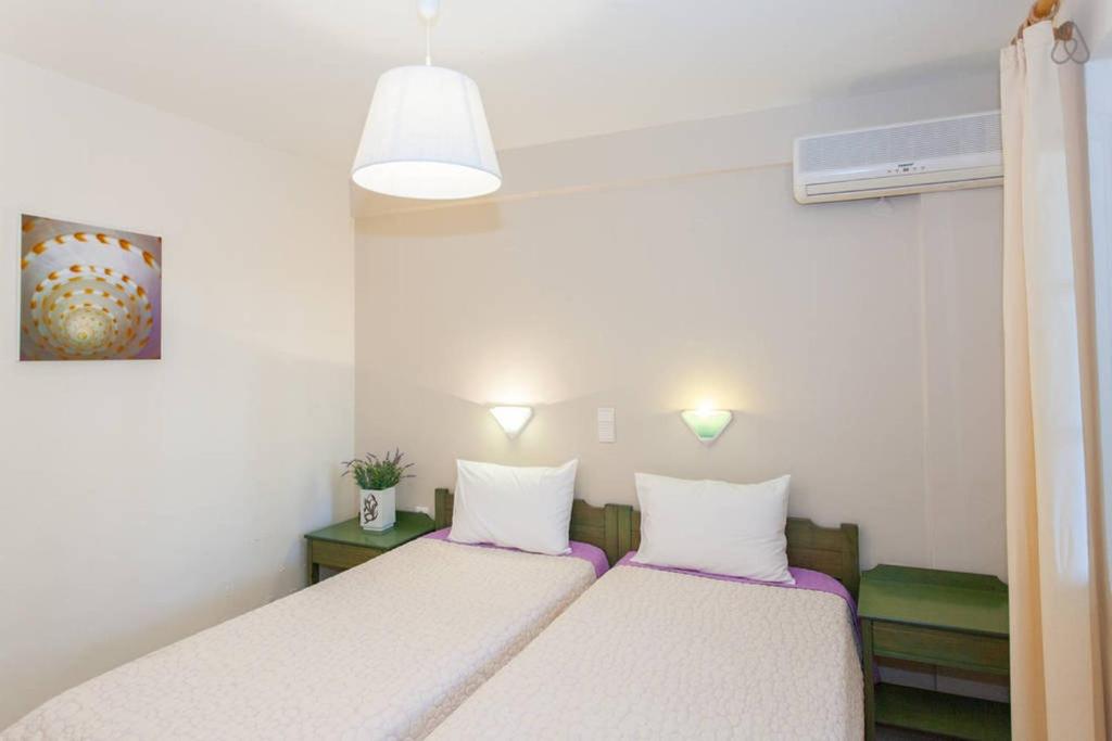 Posteľ alebo postele v izbe v ubytovaní Armonia Apartments
