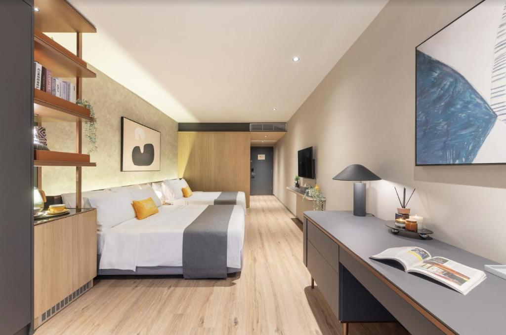 Letto o letti in una camera di Dash Living on Prat