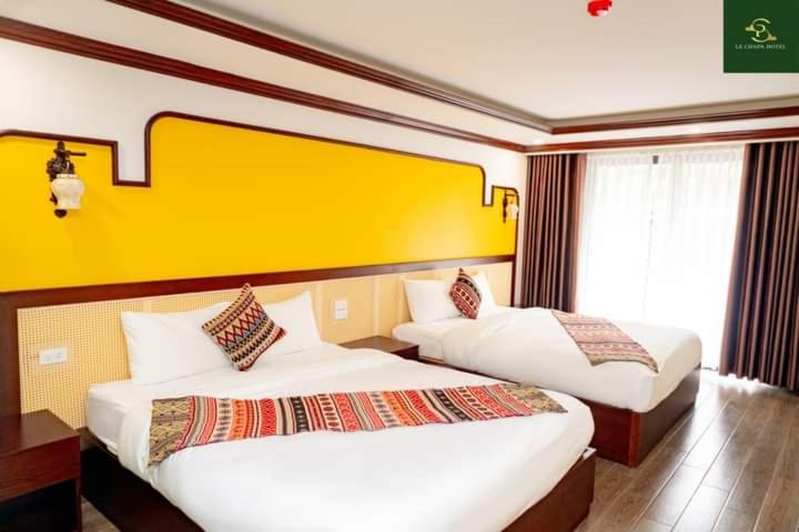 Postel nebo postele na pokoji v ubytování Le Chapa Hotel & Spa
