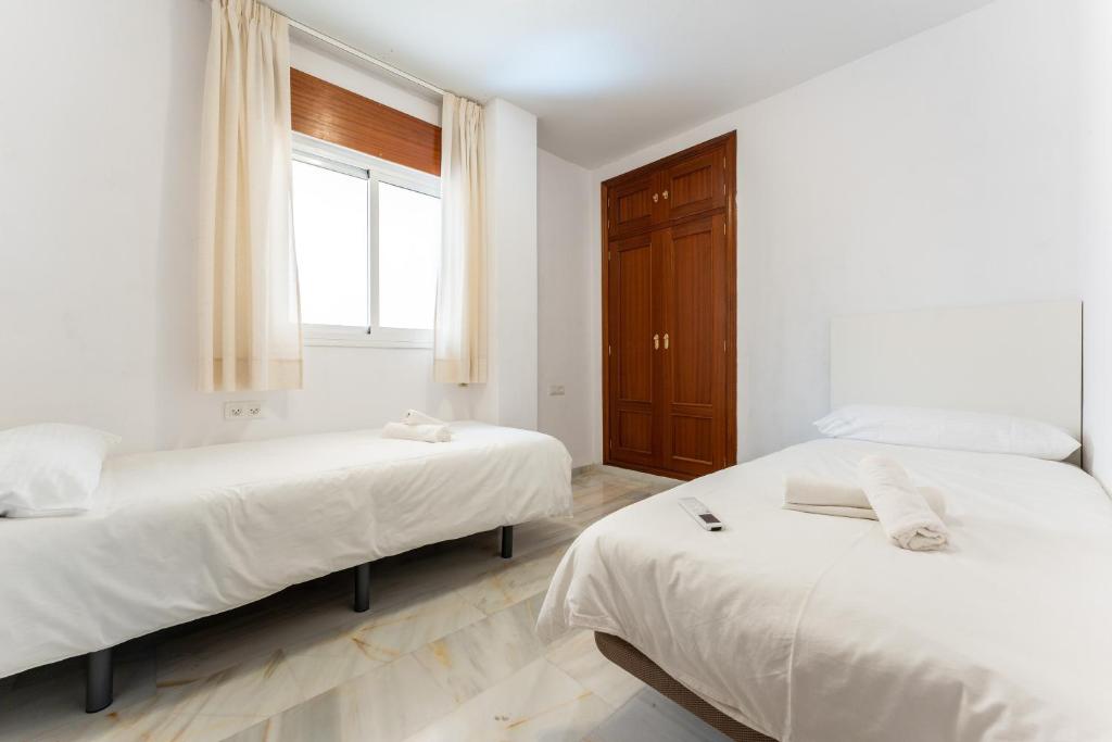 Postel nebo postele na pokoji v ubytování Apartamento Ramon y Cajal