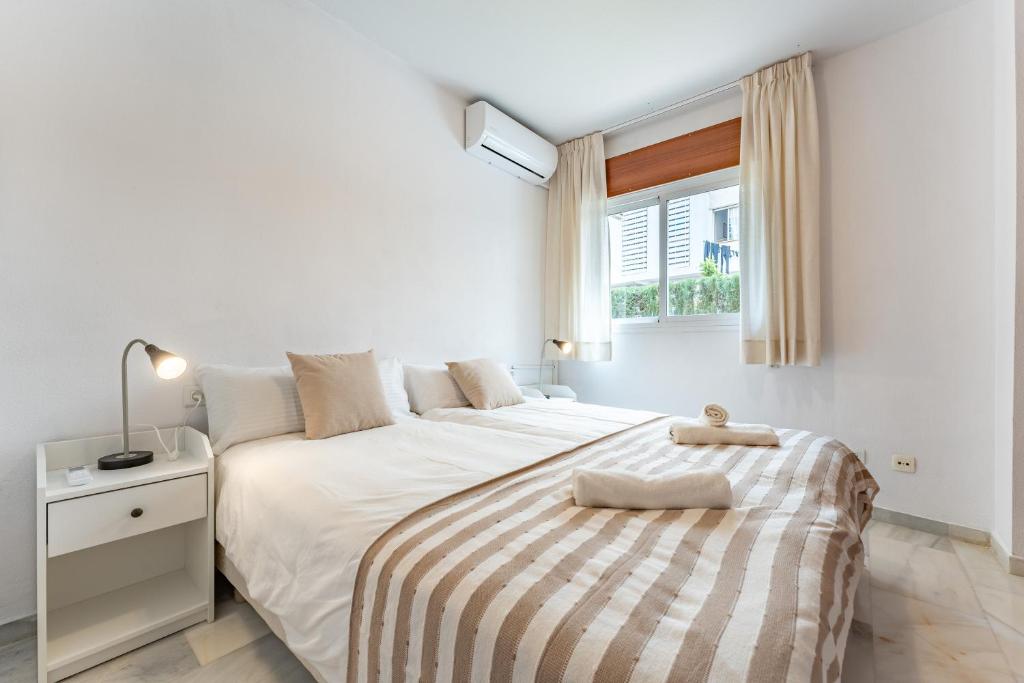 Postel nebo postele na pokoji v ubytování Apartamento Ramon y Cajal