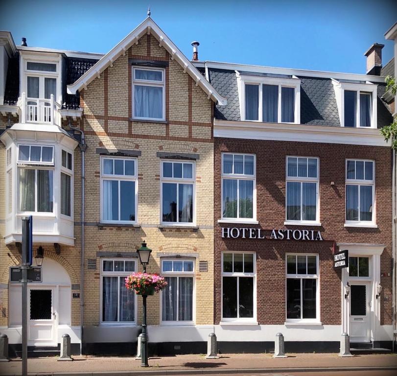a hotel australia building on a city street at Hotel Astoria The Hague in The Hague