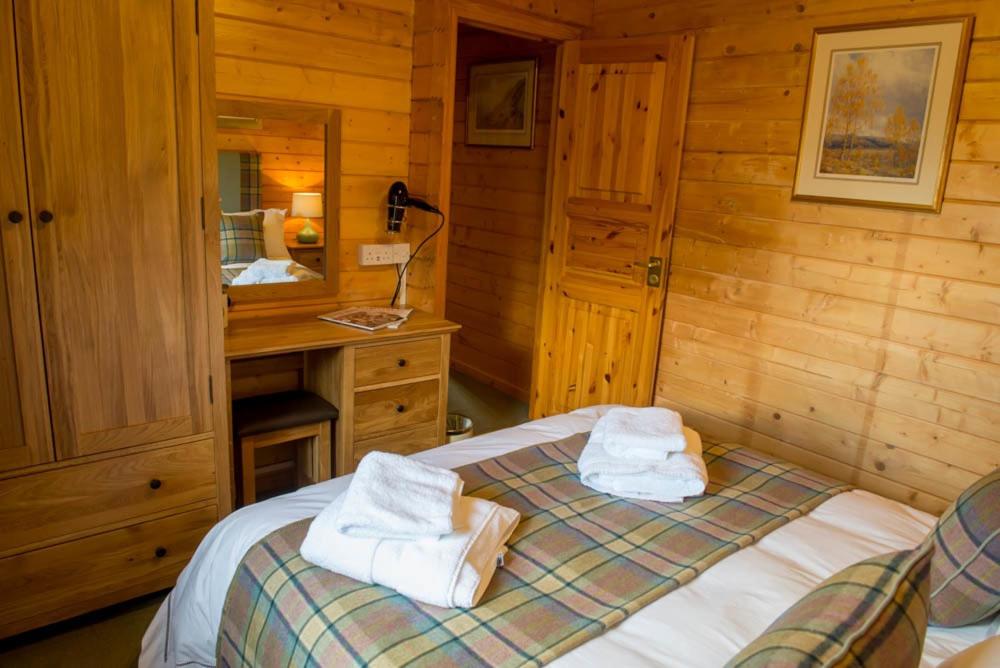 Postel nebo postele na pokoji v ubytování Stable Lodge