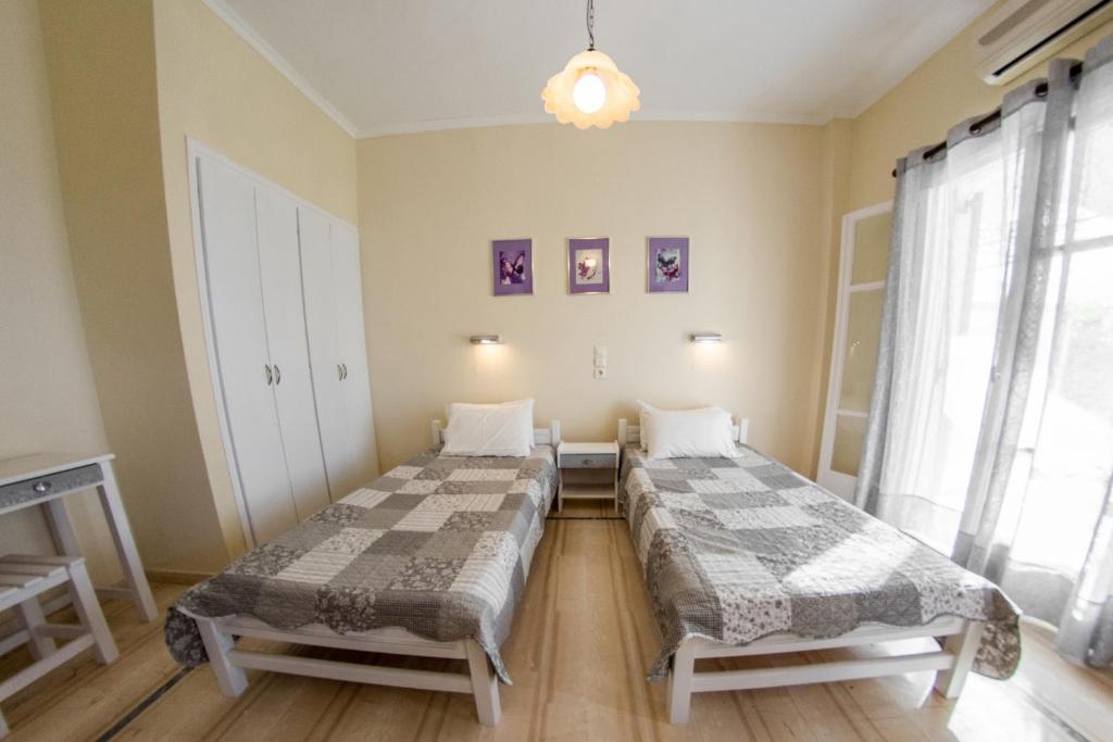A bed or beds in a room at Eleonas Holiday Home Apartment