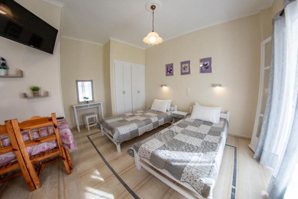 A bed or beds in a room at Eleonas Holiday Home Apartment