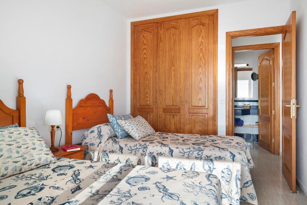 Postel nebo postele na pokoji v ubytování Callao Beach 1