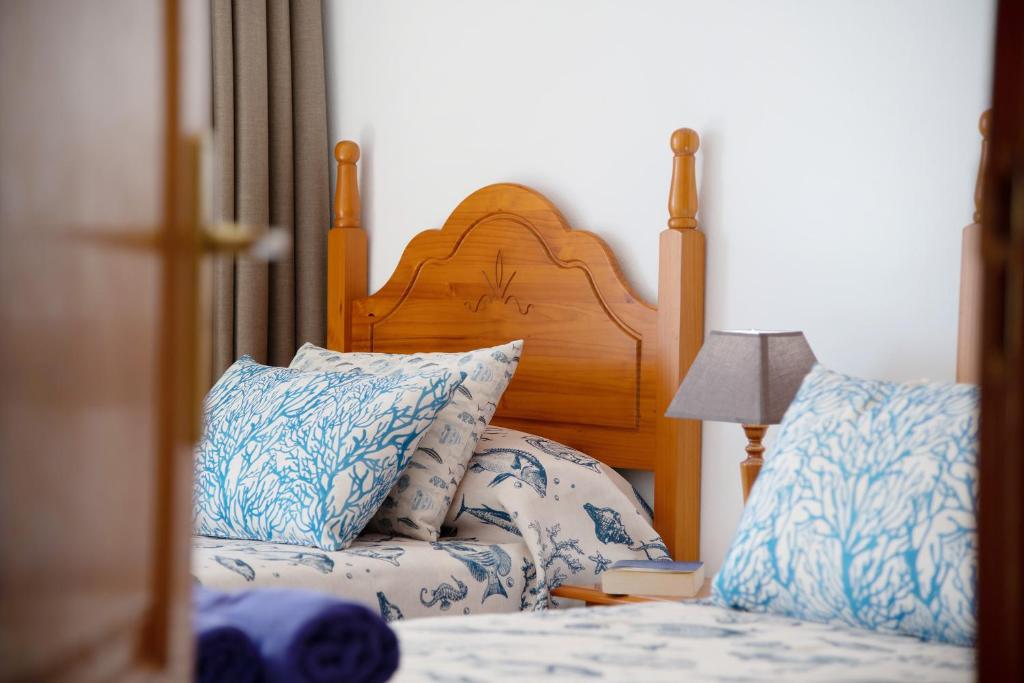 A bed or beds in a room at Callao Beach 2