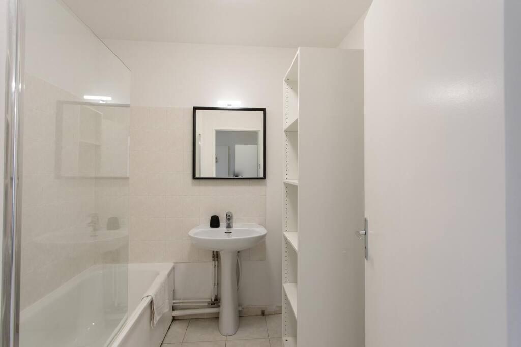 a white bathroom with a sink and a shower at L41 Suite Paladium parking 8pax 4rooms balcony WIFI&#47;AC in Nice
