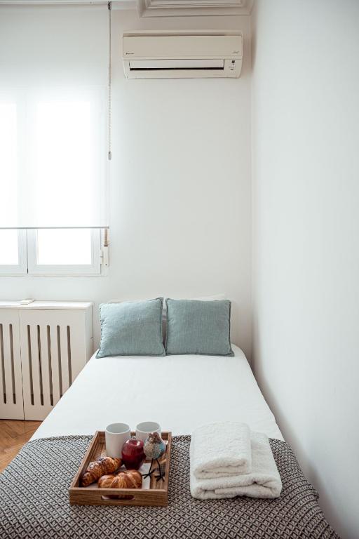 A bed or beds in a room at My City Home - Amplio apartamento en Salamanca