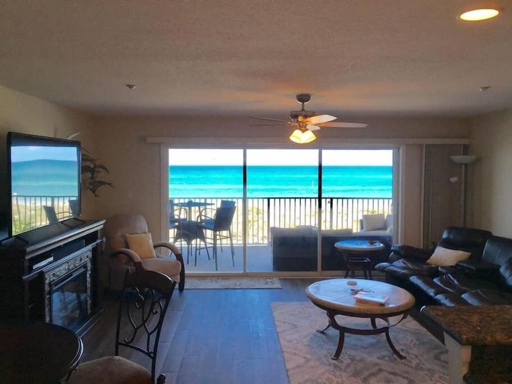 a living room with a view of the ocean at OW 202 - Entire Oceanfront Condo - 2 BR and 2 Bath in Indian Rocks Beach