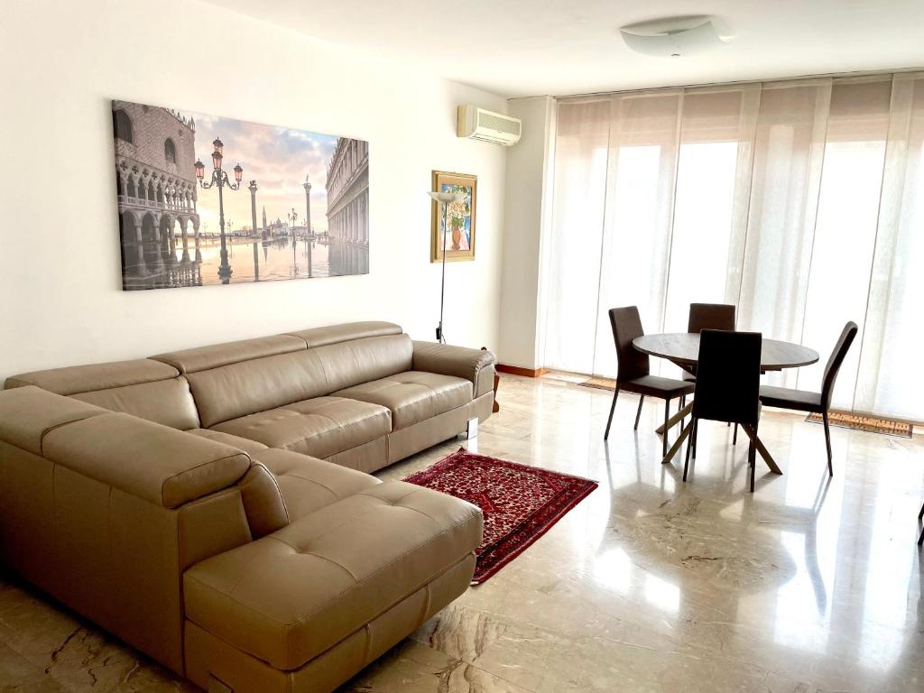 a living room with a couch and a table at Apartment Donatello in Mestre