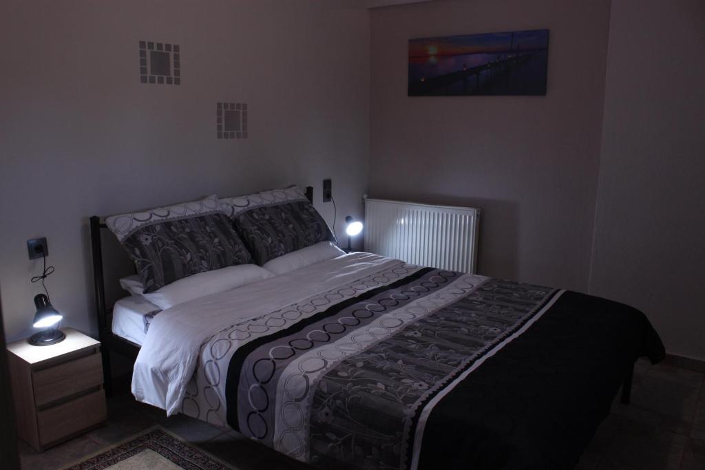 a bedroom with a large bed in a room at apartment to nature B in Ámmos