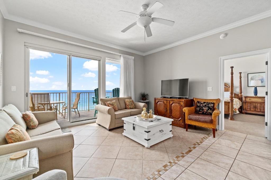 a living room with a view of the ocean at Treasure Island 0507 in Panama City Beach
