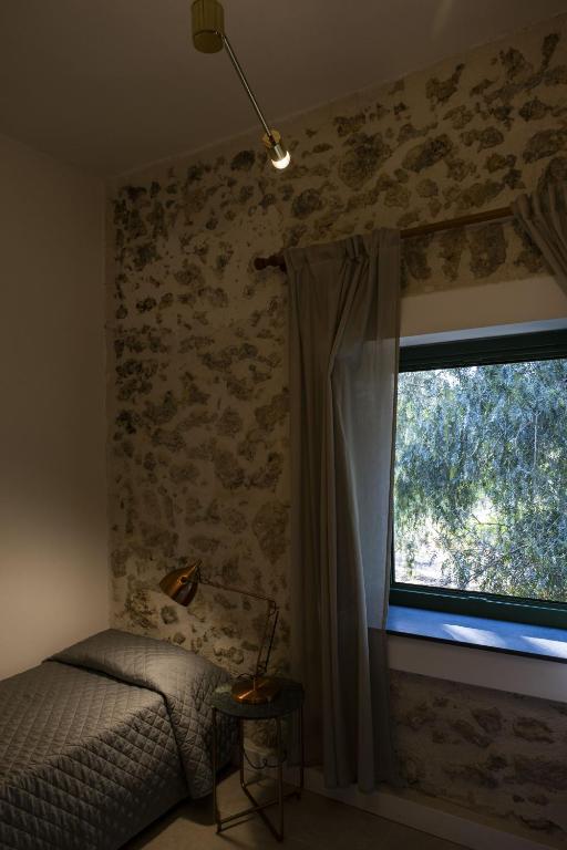 Posteľ alebo postele v izbe v ubytovaní Agriturismo Baglio Làuria