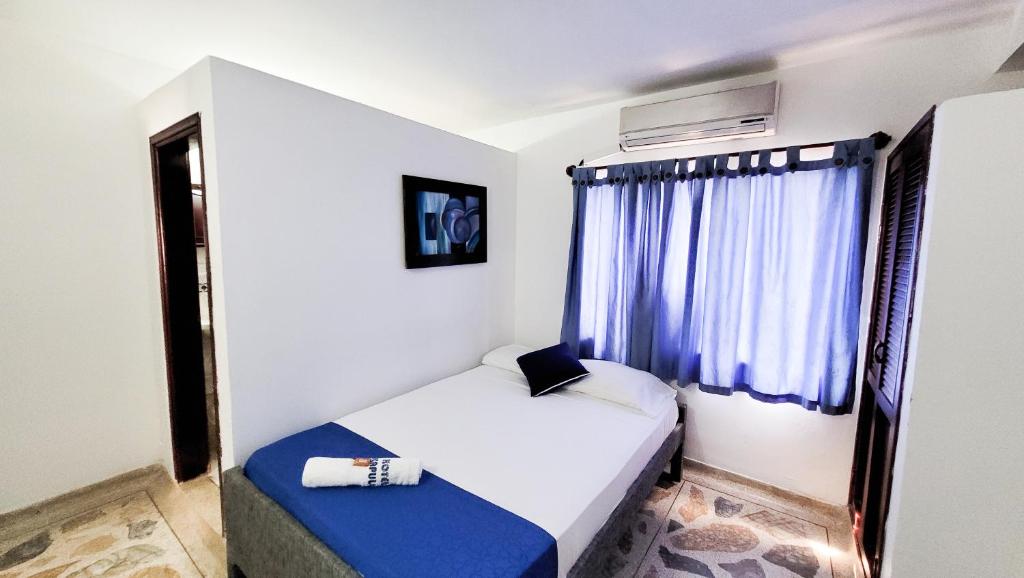 Postel nebo postele na pokoji v ubytování Hotel Acapulco Caucasia