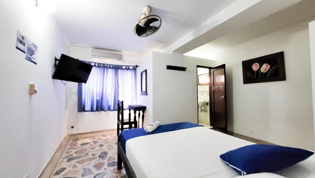 Postel nebo postele na pokoji v ubytování Hotel Acapulco Caucasia